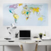 | Casadart | Vinis Autocolantes, Papel de Parede e Painéis Decorativos Modern white desk workspace with a laptop, monitor, task lamp, and small potted plants in front of a large world map wall poster