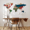 | Casadart | Vinis Autocolantes, Papel de Parede e Painéis Decorativos World map mural made from national flags on a wall above a wooden table and chairs in a bright room.
