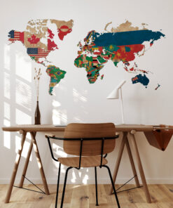 World map mural made from national flags on a wall above a wooden table and chairs in a bright room.