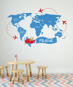 | Casadart | Vinis Autocolantes, Papel de Parede e Painéis Decorativos Blue world map wall mural with red airplanes circling and a kid-friendly table, pencils, and a chevron rug in a playroom.