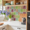 | Casadart | Vinis Autocolantes, Papel de Parede e Painéis Decorativos Colorful tiled kitchen wall above a white countertop, with hydrangea bouquet in a vase and green bowls on a shelf.