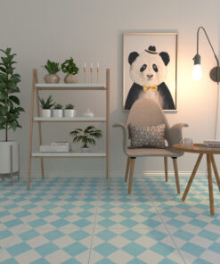 Cozy reading nook with a beige armchair, standing lamp, panda artwork, and a wooden shelf holding plants and books against a pale wall.
