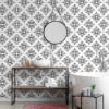 | Casadart | Vinis Autocolantes, Papel de Parede e Painéis Decorativos Modern bathroom with black-and-white geometric tiled wall, round wall mirror, and white vessel sink on a metal frame with pink rug below.