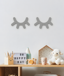 Playful children's desk setup with a lightbox reading 'OH HAPPY DAY', pencils in a holder, a plush bear, and decorative framed art on a wooden shelf.