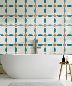 White freestanding bathtub in a bathroom with teal-and-brown geometric wallpaper and a wooden ladder shelf.