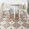 | Casadart | Vinis Autocolantes, Papel de Parede e Painéis Decorativos Round marble-topped table on a white pedestal, surrounded by light wooden chairs against a white brick wall.