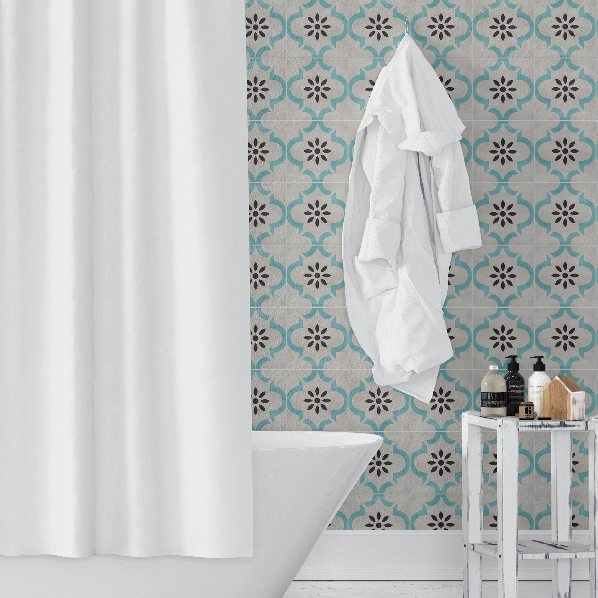 Bathroom-Scene-Mockup-v5 | Casadart | Vinis Autocolantes, Papel de Parede e Painéis Decorativos White tub in a bathroom with teal patterned tiles, a white robe hanging, and bottles on a wooden stand nearby