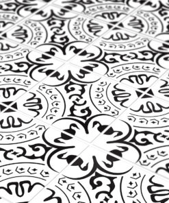 Close-up of a repeating black-and-white ornamental tile pattern with circular motifs and swirling designs.