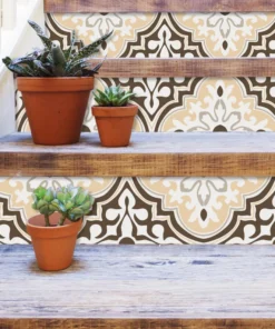 Terracotta pots with succulents on weathered wooden stairs, set against a beige-brown patterned tile wall.