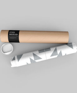 Rolled sheet of kitchen backsplash stickers in a cardboard tube, labeled 'Kitchen Backsplash' on a black band, with décor items nearby on a gray backdrop.
