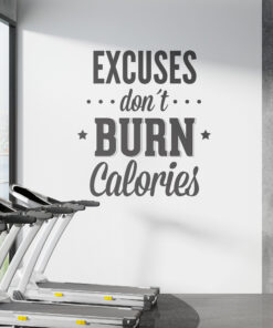Row of treadmills in a bright gym beside a bold wall mural that reads 'EXCUSES don’t burn calories' as motivation to workout.
