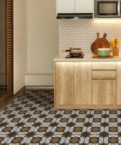 Modern kitchen with light wood cabinets, hexagonal tile backsplash, and a patterned tile floor; utensils and cookware on the counter.