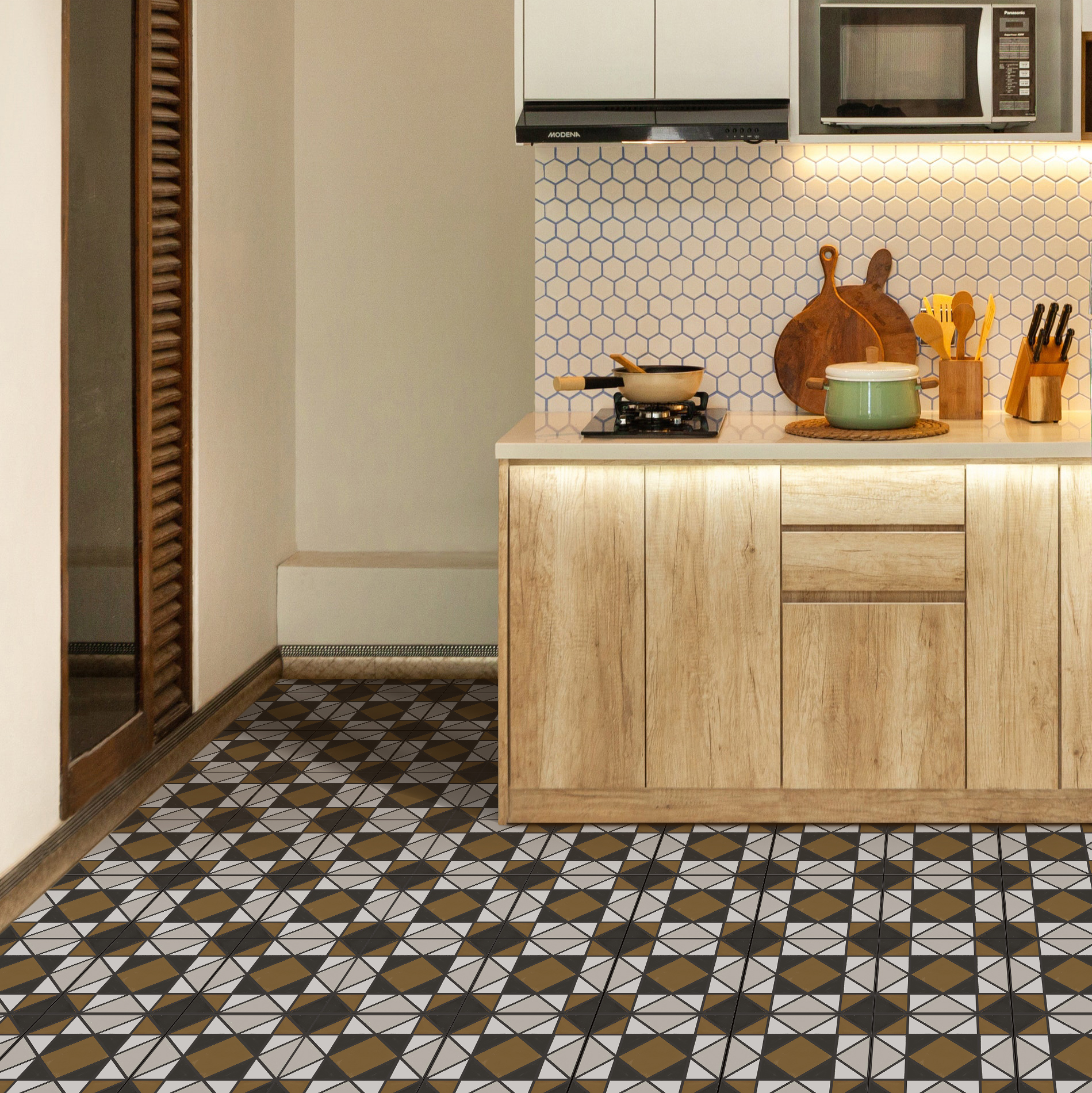 2 | Casadart | Vinis Autocolantes, Papel de Parede e Painéis Decorativos Modern kitchen with light wood cabinets, hexagonal tile backsplash, and a patterned tile floor; utensils and cookware on the counter.
