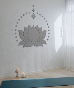 Calm yoga studio corner with a large lotus wall art, candles on the floor, and blue mats on a wooden floor.