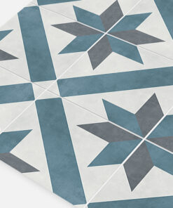 Decorative ceramic tile floor with blue and gray star-shaped patterns and diagonal lines seen at an angle.