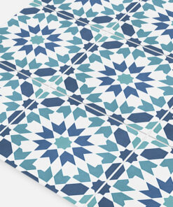 Decorative geometric tile pattern with blue and teal star shapes on white tiles, arranged in a repeating mosaic.