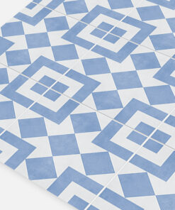 Close-up of blue and white geometric tiled floor with diamond and square patterns.