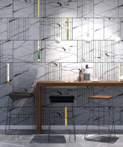 Modern bar or cafe area with a marble tile wall, gold-accented pendant lights, and a wooden counter with glassware and bottles.