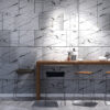 NS895-simples-2 | Casadart | Vinis Autocolantes, Papel de Parede e Painéis Decorativos Modern bar area with a marble tiled wall, wooden counter, metal stools, hanging pendant lights, and bottles on the counter.