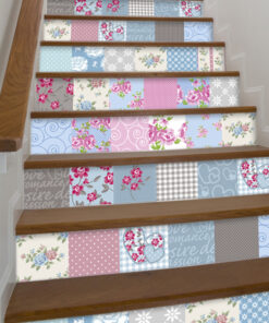 Stair risers covered in pastel patchwork wallpaper with floral, polka dot, and heart patterns in blue, pink, and gray hues.