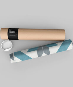 Cardboard poster tube with a black 'Tile Stickers' label on a grey background, with a white cup rim and a blue-patterned sheet nearby.