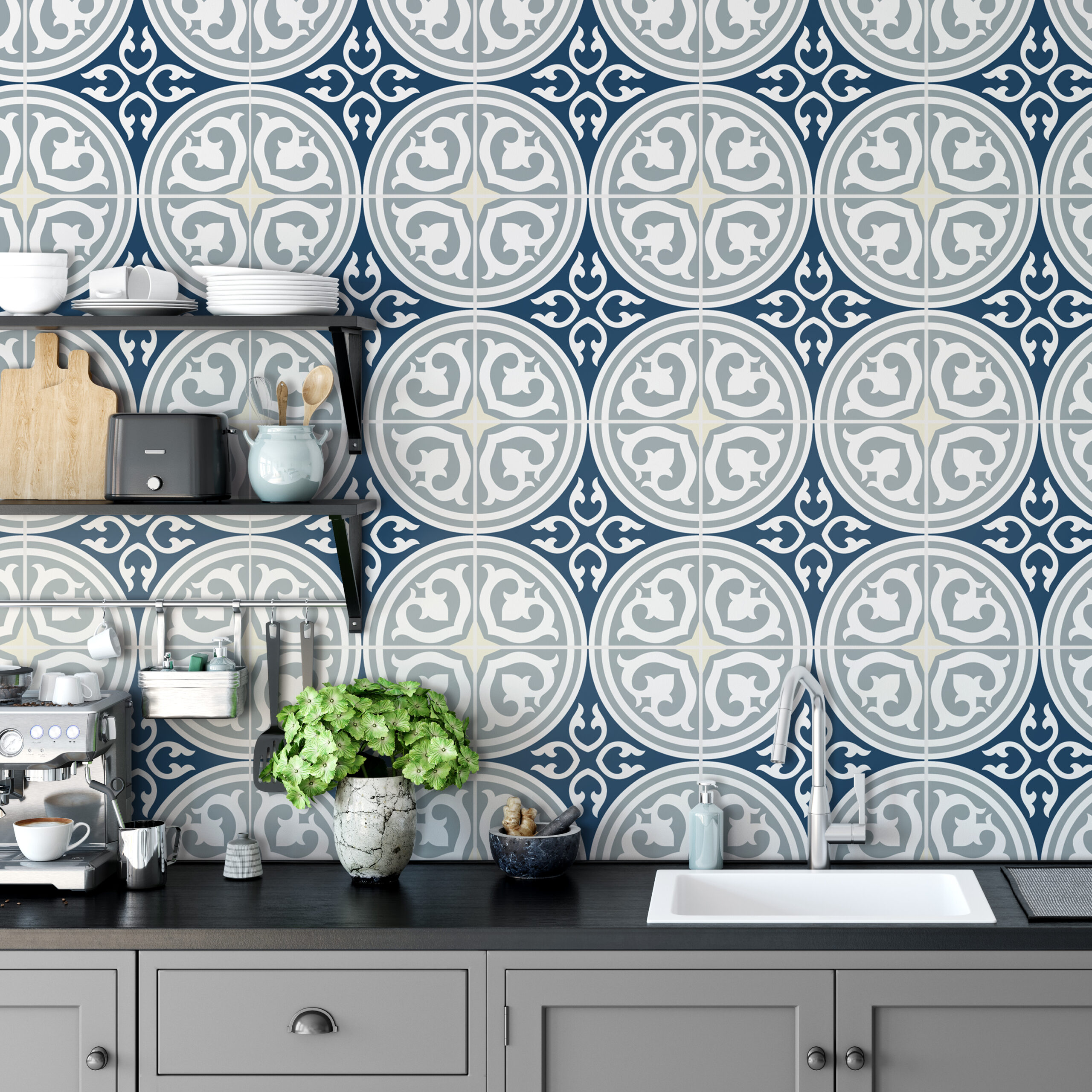 ds kitchen black -1 copy 7 | Casadart | Vinis Autocolantes, Papel de Parede e Painéis Decorativos Grey kitchen counter with a blue geometric tiled wall; shelves hold cups, plates, kettle, toaster, and utensils; a green plant sits in a marble vase.