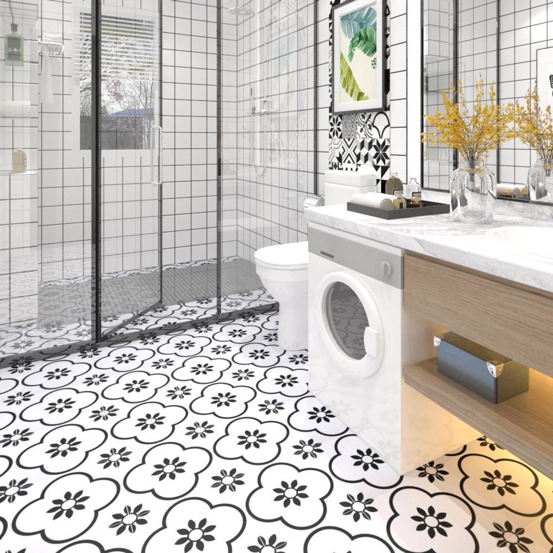 | Casadart | Vinis Autocolantes, Papel de Parede e Painéis Decorativos Modern white bathroom with a glass shower, black-and-white patterned floor, and a front-loading washing machine under a marble counter.
