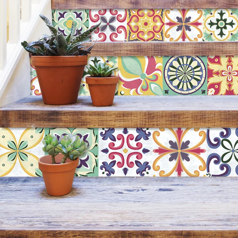 il_794xN1550114048_5n7u | Casadart | Vinis Autocolantes, Papel de Parede e Painéis Decorativos Three terracotta pots with succulents sit on wooden staircase risers covered in colorful patterned tiles.