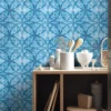 | Casadart | Vinis Autocolantes, Papel de Parede e Painéis Decorativos Wood kitchen counter with white canisters and utensils (whisk and wooden spoons) atop a blue geometric tiled wall, with shelves and storage below.