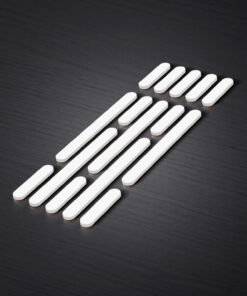 White rounded rectangular bars arranged in rows on a dark wooden surface.