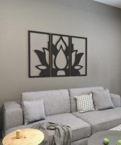 Three-panel black metal wall art depicting a stylized flower above a gray sofa.