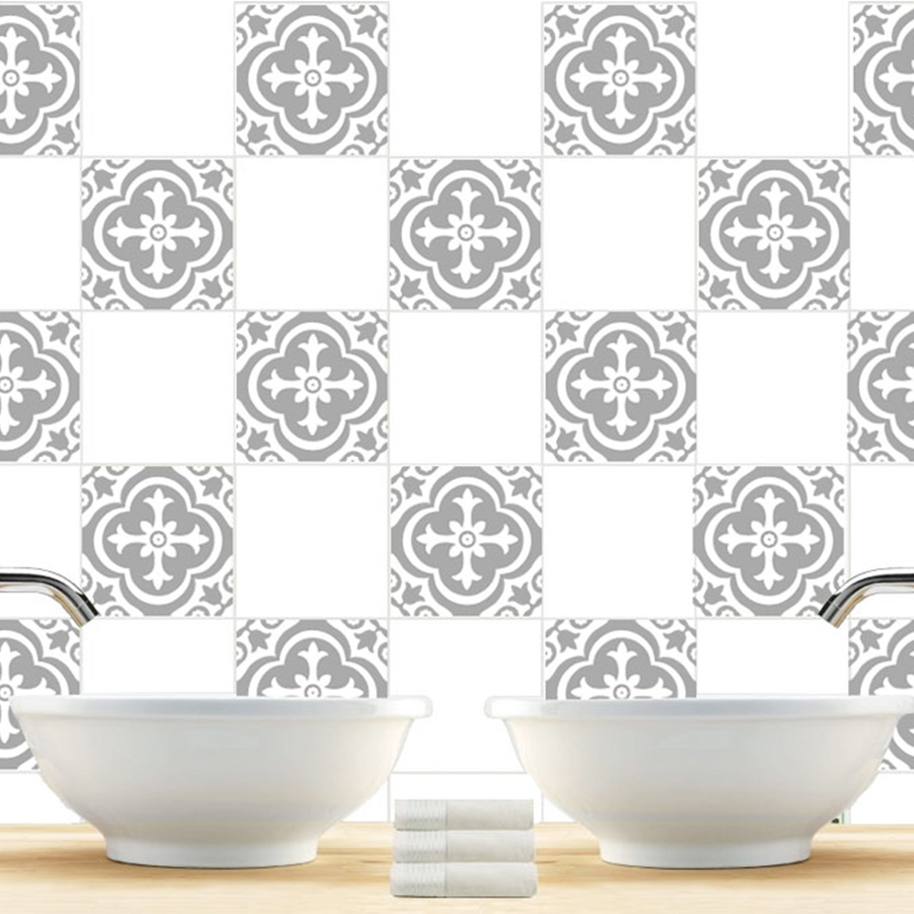 moroccan-tiles | Casadart | Vinis Autocolantes, Papel de Parede e Painéis Decorativos Double white ceramic sinks with chrome faucets above a wooden counter and patterned gray tile wall, towels in the center.