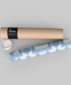 Rolled cardboard poster tube with black label reading 'TILE CREDENZAS' and 'STICKER IN ROLL', plus a white cup and blue geometric paper nearby on a gray surface