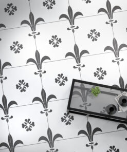 Gray and white tiled wallpaper with a repeating fleur-de-lis motif.
