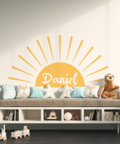 Sunburst wall art behind a sofa with pastel cushions and a plush dog nearby, on a dark wooden floor., with wooden toy trucks on the floor in the foreground.