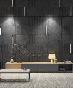 Modern living room display with dark tiled wall, light wood console, and decorative lamps and plants on a striped rug.